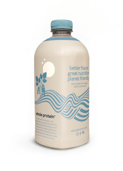 Wholemoon oat whole protein milk side angle featuring the brand's origin story and mission on minimalist beige packaging